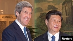 U.S. Secretary of State John Kerry is greeted by Chinese President Xi Jinping. April 13, 2013.