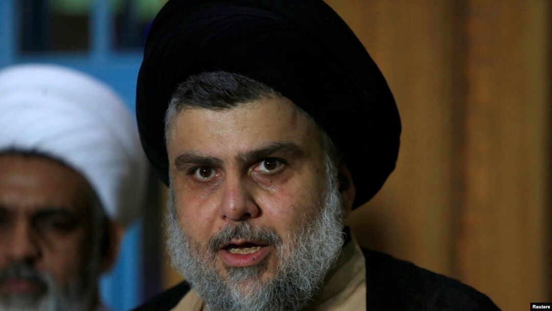 FILE - Iraqi Shi'ite cleric Moqtada al-Sadr speaks during a news conference with Leader of the Conquest Coalition and the Iran-backed Shi'ite militia Badr Organisation Hadi al-Amiri, in Najaf, June 12, 2018.