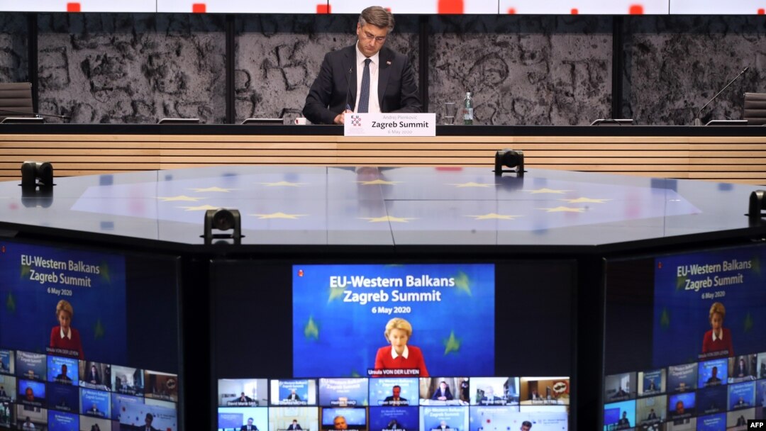 FILE - Croatian Prime Minister Andrej Plenkovic, center, takes part in a video conference with President of the European Commission Ursula Von der Leyen, on screen, and heads of state of EU members in Zagreb, May 6, 2020.
