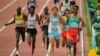 ARCHIVO - El guatemalteco Luis Grijalva, segundo a la derecha, captado en las competencias masculinas de 5.000 metros durante el Campeonato Mundial de Atletismo en Budapest, Hungría, el 24 de agosto de 2023.