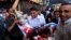 Egyptians evacuate a wounded man during clashes between security forces and supporters of Egypt's ousted President Morsi, Aug. 16, 2013.