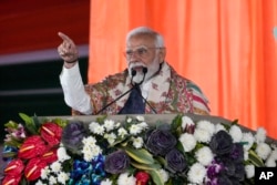 FILE —Indian Prime Minister Narendra Modi addresses a public rally at the Moulana Azad Stadium during which he inaugurated several projects in Jammu and Kashmir, in Jammu, India, February 20, 2024.