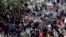 Migrants queue at the compound outside the Berlin Office of Health and Social Affairs (LaGeSo) as they wait for their registration in Berlin, Germany, Sept. 21, 2015. 