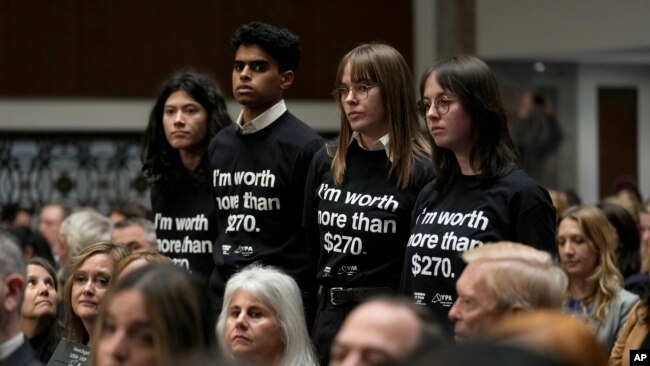 Protesters stand up during a Senate Judiciary Committee hearing with social medial platform heads on Capitol Hill in Washington, Jan. 31, 2024, to discuss child safety.