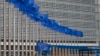 Workers adjust the EU flags in front of EU headquarters in Brussels, Belgium, June 22, 2016. Voters in the United Kingdom are taking part in a referendum that will decide whether Britain remains part of the European Union or leaves the 28-nation bloc. 