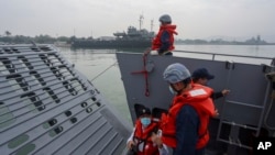 FILE - Navy soldiers stand on a landing craft during a military drill in Kaohsiung City, Taiwan on January 12, 2023. 