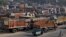 Trucks are seen parked in an open lot near a national highway on the outskirts of Ahmedabad, India, Dec. 2, 2015.