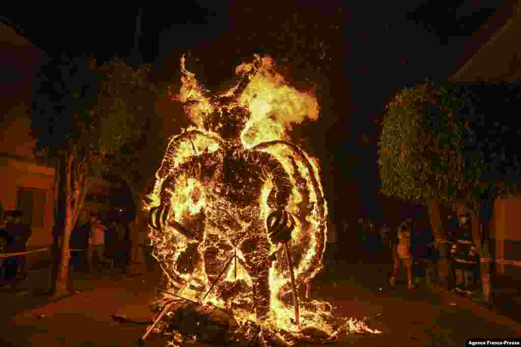 A figure representing the devil burns during the celebration of the Virgin of the Immaculate Conception, in Guatemala City, Dec. 7, 2021.&nbsp;The event marks the beginning of the Christmas season in the country.