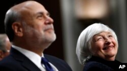 Federal Reserve Chair Janet Yellen, right, and former Federal Reserve Chair Ben Bernanke smile during introductions at a ceremony awarding them both with the Paul H. Douglas Award for Ethics in Government on Capitol Hill in Washington, Nov. 7, 2017. 