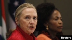U.S. Secretary of State Hillary Clinton (L) speaks next to South African Foreign Minister Maite Nkoana-Mashabane during the U.S.-South Africa Strategic Dialogue in Pretoria, August 7, 2012. 