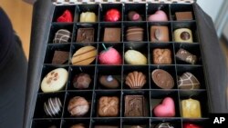 FILE—A selection box of luxury handmade Belgian Chocolates is displayed at Sandrine a chocolate shop owned by Niaz Mardan, in south west London, March 21, 2024. 