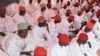 FILE - In this photo taken on Thursday, Dec. 19, 2013. Nigerian Muslim men attend a mass wedding in Kano, Nigeria.