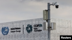 A CCTV camera is seen on a pole near the entrance to the venue of the United Nations climate change conference, known as COP29, ahead of the summit beginning in Baku, Azerbaijan, Nov. 10, 2024. 