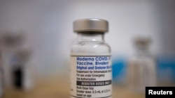 FILE: FILE PHOTO: A vial of the Moderna coronavirus disease (COVID-19) booster vaccine targeting BA.4 and BA.5 Omicron sub variants is pictured. Taken September 8, 2022. 