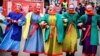 Street performers dance on Tverskaya Street during a festival marking the New Year and Christmas in central Moscow, Russia.