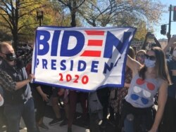 Biden supporters celebrate his projection as U.S. president-elect near the White House in Washington, Nov. 7, 2020. (Margaret Besheer/VOA)