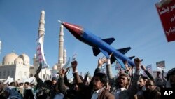 FILE - Houthi supporters attend a rally in support of the Palestinians in the Gaza Strip and against the U.S.-led airstrikes on Yemen, in Sanaa, Yemen, January 26, 2024