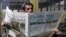 A man reads a Kurdish newspaper in southeastern city of Diyarbakir, Turkey, March 22, 2009.