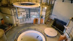 FILE - In this photo released by the Atomic Energy Organization of Iran, technicians work on the Arak heavy water reactor's secondary circuit, near Arak, 150 miles (250 kilometers) southwest of the capital Tehran, Iran, Dec. 23, 2019. 