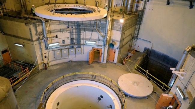 FILE - In this photo released by the Atomic Energy Organization of Iran, technicians work on the Arak heavy water reactor's secondary circuit, near Arak, 150 miles (250 kilometers) southwest of the capital Tehran, Iran, Dec. 23, 2019.