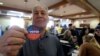 Frank Salazar, 70, shows an 'I voted' sticker after casting his ballot on the Super Tuesday, at a voting center in Alhambra, Calif., March 3, 2020. 