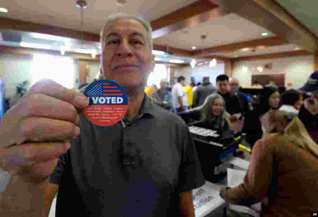 Frank Salazar, 70, shows an &#39;I voted&#39; sticker after casting his ballot on the Super Tuesday, at a voting center in Alhambra, Calif., March 3, 2020. 