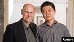 Juan Carlos Izpisua Belmonte, professor at Salk Institute's Gene Expression Laboratory and Jun Wu, Salk staff scientist are pictured in this handout photo obtained by Reuters, Aug. 2, 2017. 