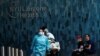 Health workers move a patient wearing a face mask at the at NYU Langone Hospital, during the outbreak of the coronavirus disease (COVID-19) in the Manhattan borough of New York City, New York, May 3, 2020.