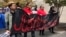 Protesters carry a sign reading “Justice for E.J.” at the Riverchase Galleria in Hoover, Ala., Nov. 24, 2018. A police officer shot and killed 21-year-old Emantic Fitzgerald Bradford, Jr. of Hueytown while responding to a shooting at the mall on Thanksgiving evening.