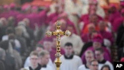 Bishops and altar boys arrive for the opening mass of the German bishops' conference in Fulda, Germany, Sept. 25, 2018, where the bishops will discuss a study on sexual abuse in the Catholic church in Germany.