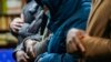 Members of the Masjid Ar Rahman pray, in the Bronx borough of New York, Jan. 12, 2022. The mosque is a place of worship for some of the residents of the building, site of New York City's deadliest fire in three decades.