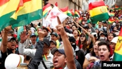 People shout slogans during a protest against Bolivia's President Evo Morales in La Paz, Bolivia, November 9, 2019. 