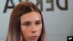 Belarusian Olympic sprinter Krystsina Tsimanouskaya, who came to Poland fearing reprisals at home after criticizing her coaches at the Tokyo Games, talks to reporters in Warsaw, Poland, Aug. 5, 2021. 