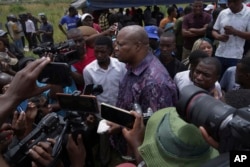 FILE — Opposition activist Job Sikhala addresses the media at the burial of Moreblessing Ali, on the outskirts of Harare, Saturday, March, 2, 2024.