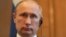 FILE - Russian President Vladimir Putin attends news conference at 10 Downing Street, London, June 16, 2013.