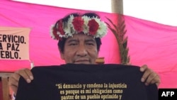 FILE - Undated picture of Catholic priest Marcelo Perez showing a T-shirt during an activity in San Cristobal de Las Casas, Chiapas state, Mexico.