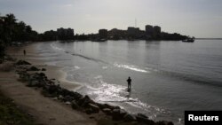 A man is seen fishing on a beach in Pampatar, Venezuela, Sept. 13, 2016.