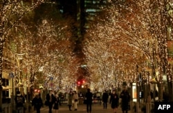 FILE - As part of winter holidays, approximately 1.2 million "champagne gold" LED lights decorate the Marunouchi business district of Tokyo, Japan, December 21, 2020. (Photo by Kazuhiro NOGI / AFP)