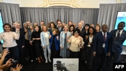 Attendees, including European Commissioner for the Environment pose for a photo as the High Seas Treaty opens for signatures, on the sidelines of the 78th United Nations General Assembly, at the Regis Hotel in New York City on September 20, 2023.