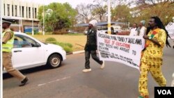 Rastafarians march to protest a ban on dreadlocks in primary schools, Lilongwe, Malawi. (Lameck Masina for VOA)