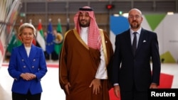 European Commission President Ursula von der Leyen, left, and European Council President Charles Michel, right, greet Saudi Crown Prince Mohammed bin Salman at the joint European Union and Gulf Cooperation Council summit in Brussels, Belgium, on Oct. 16, 2024.