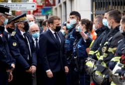 French President Emmanuel Macron visits the scene of a knife attack at Notre Dame church in Nice, France, Oct. 29, 2020.