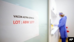 A door sign shows the batch of AstraZeneca vaccine currently used at a vaccination center in Bucharest, Romania, April 7, 2021.