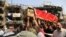 Mourners carry the Iraqi flag-draped coffin of, Akram Hadi, 24, in a Sunday massive truck bomb attack in the Karada neighborhood of Baghdad, Iraq, July 5, 2016. 