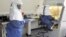 Doctors work in a laboratory on collected samples of the Ebola virus at the Center for Disease Control in Entebbe, southwest of Kampala, August 2, 2012. 