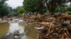 This handout photo provided by the Polish fire department shows firefighters removing debris dumped in the streets by a flood wave passing through southwestern Poland, in Glucholazy, Poland, Sept. 17, 2024. (Marcin Muskala/KG PSP via AP)