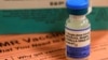 FILE PHOTO: A vial of measles, mumps and rubella vaccine and an information sheet is seen at Boston Children's Hospital in Boston, Massachusetts February 26, 2015. REUTERS/Brian Snyder/
