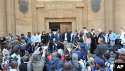 Leaders of the African National Congress Youth League speak outside the Johannesburg court where a judge ruled that leader Julius Malema has no right to sing a song some whites find offensive, September 12, 2011.