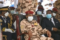 FILE - The son of the late Chadian president Idriss Deby, general Mahamat Idriss Deby, right, attends the state funeral for the late Chadian president Idriss Deby in N'Djamena, April 23, 2021.