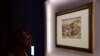 FILE - A visitor looks at a landscape by Italian master Leonardo Da Vinci presented at the Palazzo Reale museum as part of the exhibition 'Leonardo Da Vinci,' in Milan, Italy.